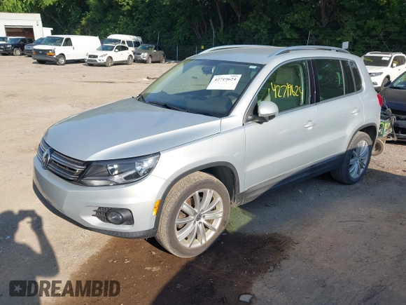 2012 Volkswagen Tiguan SE with VIN WVGBV7AX7CW580259, listed as a IAAI auction lot 42719624 with 94,710 mi miles and . Bid and sale history available at DreamBid. Image 2.