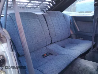1983 Toyota Celica z VIN JT2RA64L7D6174381, wystawiony jako Copart lot #75986554 z przebiegiem 312 583 mil mil oraz Szkoda całkowita • Salvage title. Historia ofert i sprzedaży dostępna na DreamBid. Obrazek 10.