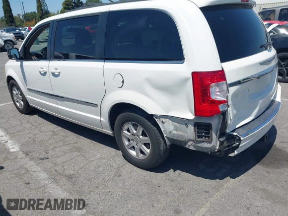 2012 Chrysler Town & Country Touring with VIN 2C4RC1BG5CR291815, listed as a IAAI auction lot 42147129 with 167,982 mi miles and . Bid and sale history available at DreamBid. Image 3.