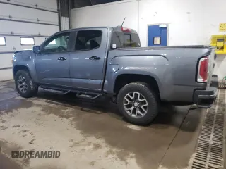 2021 GMC Canyon 4WD AT4 z VIN 1GTG6FEN1M1203936, wystawiony jako Copart lot #56041315 z przebiegiem 54 939 mil mil oraz Szkoda całkowita • Salvage title. Historia ofert i sprzedaży dostępna na DreamBid. Obrazek 2.