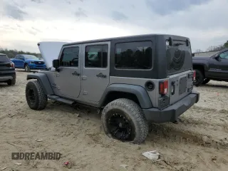 2015 Jeep Wrangler Unlimited Willys Wheeler with VIN 1C4BJWDG4FL723924, listed as a Copart auction lot 47145245 with 166,256 mi miles and Salvage Title. Bid and sale history available at DreamBid. Image 2.