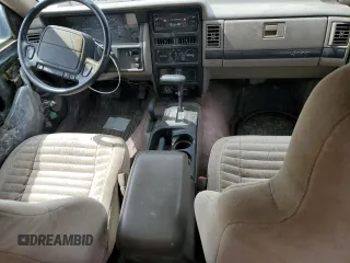1993 Jeep Grand Cherokee Laredo with VIN 1J4GZ58Y8PC513026, listed as a Copart auction lot 57001465 with 135,242 mi miles and Clean title. Bid and sale history available at DreamBid. Image 8.