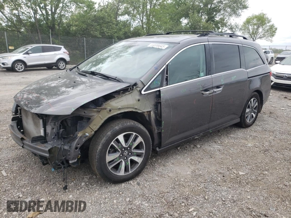 2014 Honda Odyssey Touring with VIN 5FNRL5H90EB014360, listed as a Copart auction lot 56699845 with 180,913 mi miles and Salvage title. Bid and sale history available at DreamBid. Image 1.