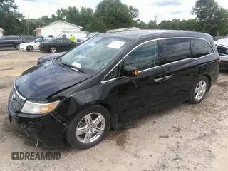 2012 Honda Odyssey Touring with VIN 5FNRL5H97CB066596, listed as a IAAI auction lot 42472935 with 217,182 mi miles and . Bid and sale history available at DreamBid. Image 17.