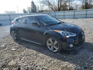 2015 Hyundai Veloster Turbo with VIN KMHTC6AE9FU217724, listed as a Copart auction lot 49740814 with 125,625 mi miles and Clean Title. Bid and sale history available at carsss.com. Image 4.