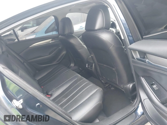 2018 Mazda 6 Grand Touring with VIN JM1GL1TY3J1334600, listed as a IAAI auction lot 41060893 with 64,852 mi miles and . Bid and sale history available at DreamBid. Image 8.