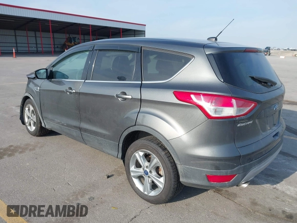 2015 Ford Escape SE with VIN 1FMCU0G73FUA77673, listed as a IAAI auction lot 41988290 with 176,734 mi miles. Bid and sale history available at carsss.com. Image 3.
