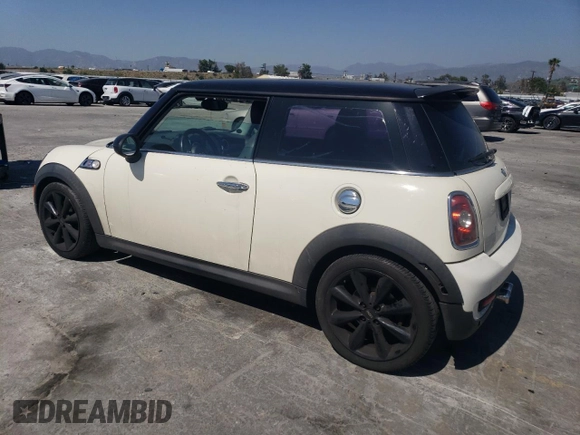 2009 MINI Hardtop S with VIN WMWMF73569TW80561, listed as a Copart auction lot 52615805 with 109,968 mi miles and Salvage title. Bid and sale history available at DreamBid. Image 2.