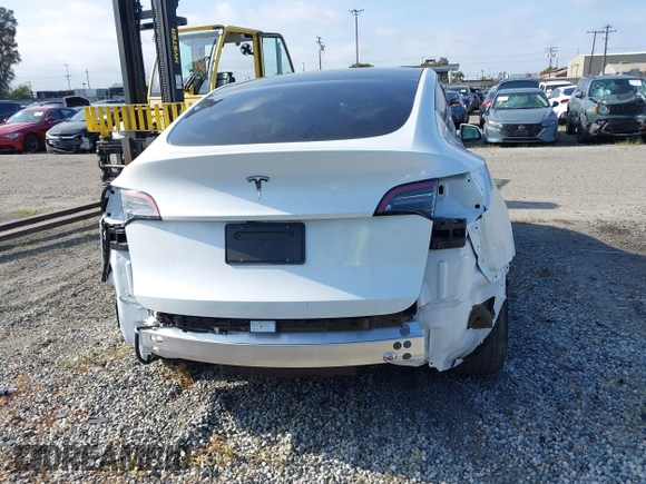 2024 Tesla Model Y with VIN 7SAYGDED2RF017448, listed as a IAAI auction lot 41597056 with 9,702 mi miles and . Bid and sale history available at DreamBid. Image 16.