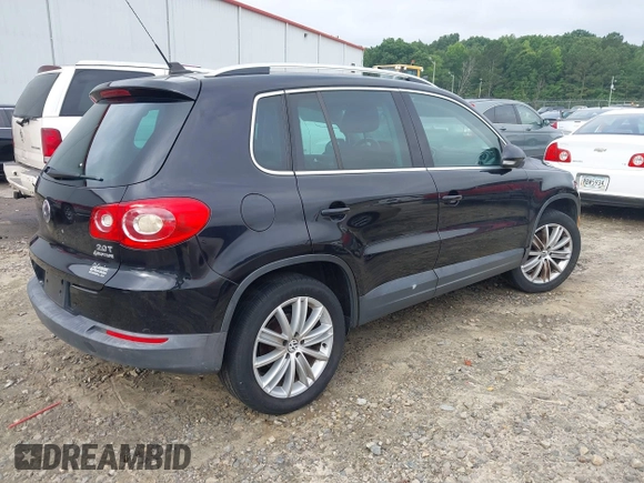 2011 Volkswagen Tiguan SEL with VIN WVGBV7AX6BW521525, listed as a IAAI auction lot 42490216 with 123,546 mi miles and . Bid and sale history available at DreamBid. Image 4.