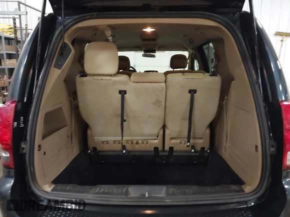 2014 Dodge Grand Caravan SXT with VIN 2C4RDGCGXER154709, listed as a IAAI auction lot 41117603 with 214,872 mi miles and . Bid and sale history available at DreamBid. Image 16.