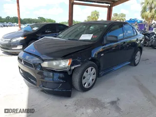 2010 Mitsubishi Lancer DE with VIN JA32U1FU3AU030048, listed as a IAAI auction lot 41953386 with 216,341 mi miles. Bid and sale history available at carsss.com. Image 2.