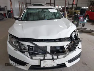2016 Honda Civic Sedan LX with VIN 19XFC2F59GE028056, listed as a IAAI auction lot 41875940 with 124,243 mi miles. Bid and sale history available at carsss.com. Image 12.