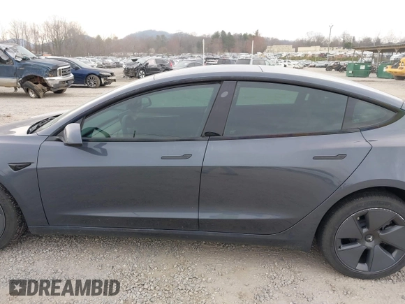 2023 Tesla Model 3 with VIN 5YJ3E1EA5PF474382, listed as a IAAI auction lot 41764268 with 31,040 mi miles and . Bid and sale history available at DreamBid. Image 13.