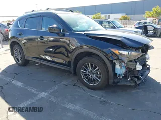 2021 Mazda CX-5 Touring z VIN JM3KFBCM6M1360480, wystawiony jako IAAI lot #40832083 z przebiegiem 12 587 mil mil oraz . Historia ofert i sprzedaży dostępna na DreamBid. Obrazek 1.