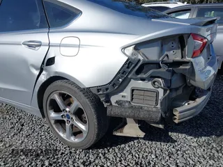 2015 Ford Fusion SE with VIN 3FA6P0H98FR267586, listed as a IAAI auction lot 41987958 with 136,919 mi miles. Bid and sale history available at carsss.com. Image 6.