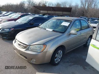 2004 Kia Spectra LX with VIN KNAFE121545043455, listed as a IAAI auction lot 41441356 with 189,566 mi miles. Bid and sale history available at carsss.com. Image 2.