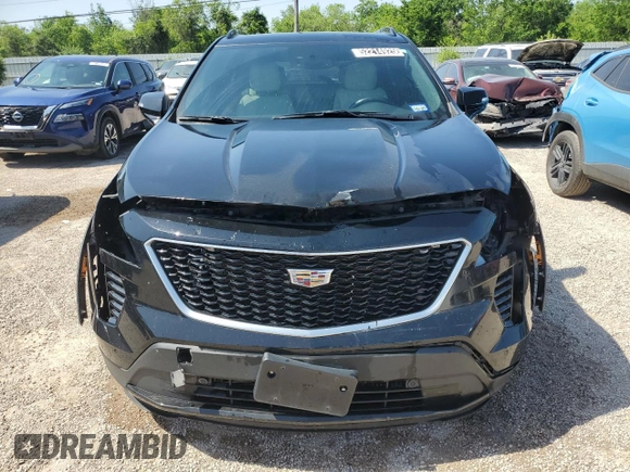 2021 Cadillac XT4 FWD Sport with VIN 1GYFZER44MF015908, listed as a Copart auction lot 52214925 with 94,079 mi miles and Clean Title. Bid and sale history available at carsss.com. Image 5.