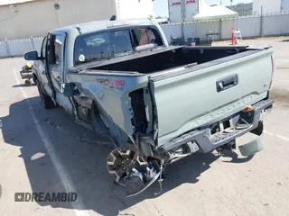 2022 Toyota Tacoma SR with VIN 3TMCZ5AN0NM489420, listed as a IAAI auction lot 42597175 with 129,340 mi miles and . Bid and sale history available at DreamBid. Image 3.
