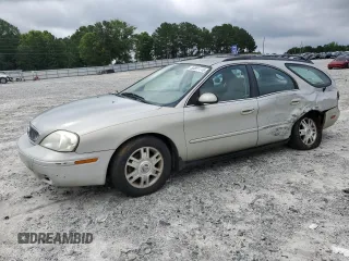 2004 Mercury Sable with VIN 1MEFM58U74A608311, listed as a Copart auction lot 60851115 with 184,201 mi miles and Salvage title. Bid and sale history available at DreamBid. Image 1.