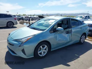 2018 Toyota Prius Two with VIN JTDKBRFUXJ3066430, listed as a IAAI auction lot 42034812 with 119,711 mi miles and . Bid and sale history available at carsss.com. Image 2.