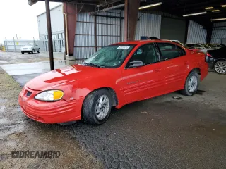 2001 Pontiac Grand Am SE1 with VIN 1G2NF52EX1C242261, listed as a Copart auction lot 82236874 with 184,935 mi miles and Salvage Title. Bid and sale history available at carsss.com. Image 1.