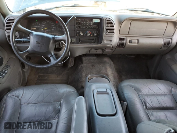 1999 GMC Yukon with VIN 1GKEK13R3XJ750307, listed as a Copart auction lot 84728104 with 212,879 mi miles and Salvage Title. Bid and sale history available at carsss.com. Image 8.