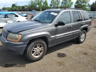2004 Jeep Grand Cherokee Laredo with VIN 1J4GW48S64C291404, listed as a Copart auction lot 62835335 with 170,365 mi miles and Salvage title. Bid and sale history available at DreamBid. Image 1.