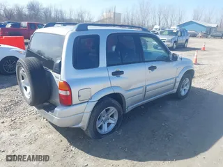 2003 Suzuki Grand Vitara with VIN JS3TD62V734105601, listed as a IAAI auction lot 42046825 with 210,728 mi miles. Bid and sale history available at carsss.com. Image 4.