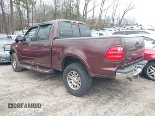 2002 Ford F-150 XLT with VIN 1FTRW08L02KA72005, listed as a IAAI auction lot 41723821 with 284,313 mi miles. Bid and sale history available at carsss.com. Image 3.