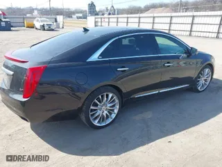 2014 Cadillac XTS Platinum with VIN 2G61W5S84E9127014, listed as a IAAI auction lot 41776334 with 99,879 mi miles. Bid and sale history available at carsss.com. Image 4.