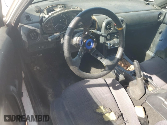 1991 Mazda MX-5 Miata Special Edition z VIN JM1NA3515M0231262, wystawiony jako Copart lot #57221675 z przebiegiem 241 670 mil mil oraz Szkoda całkowita • Salvage title. Historia ofert i sprzedaży dostępna na DreamBid. Obrazek 8.