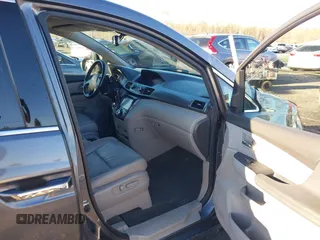 2014 Honda Odyssey Touring with VIN 5FNRL5H94EB081267, listed as a IAAI auction lot 41199509 with 146,827 mi miles and . Bid and sale history available at DreamBid. Image 5.