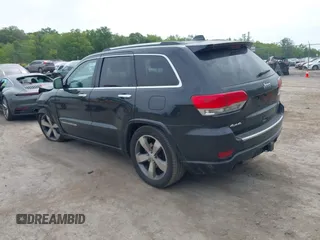 2015 Jeep Grand Cherokee Overland z VIN 1C4RJFCG3FC753772, wystawiony jako IAAI lot #42357411 z przebiegiem 130 970 mil mil oraz . Historia ofert i sprzedaży dostępna na DreamBid. Obrazek 3.