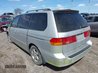 2001 Honda Odyssey EX z VIN 2HKRL18661H597205, wystawiony jako IAAI lot #41838509 z przebiegiem 317 084 mil mil oraz . Historia ofert i sprzedaży dostępna na DreamBid. Obrazek 3.