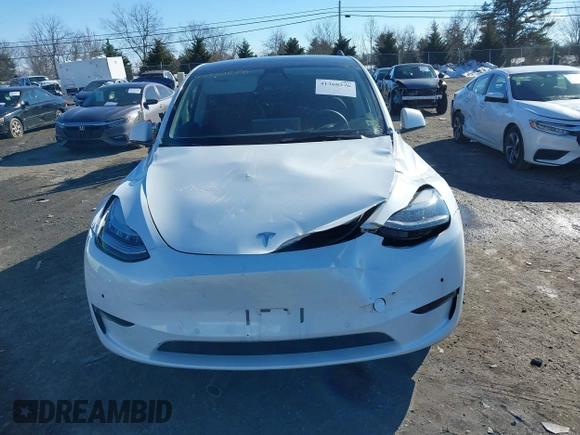 2022 Tesla Model Y Long Range with VIN 7SAYGDEE2NF440548, listed as a IAAI auction lot 41360276 with 19,714 mi miles and . Bid and sale history available at carsss.com. Image 12.