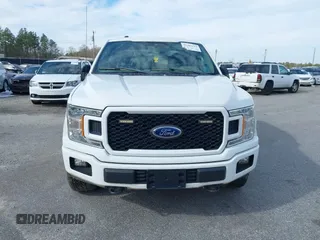 2019 Ford F-150 XL with VIN 1FTEW1E51KFC52807, listed as a IAAI auction lot 41383212 with 124,244 mi miles and . Bid and sale history available at DreamBid. Image 12.