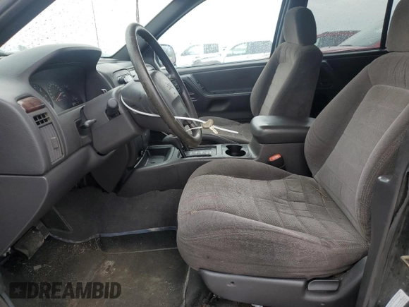 2000 Jeep Grand Cherokee Laredo z VIN 1J4GW48S1YC326453, wystawiony jako Copart lot #57332675 z przebiegiem 290 059 mil mil oraz Czysty tytuł • Clean title. Historia ofert i sprzedaży dostępna na DreamBid. Obrazek 7.