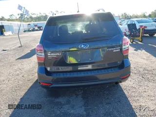 2014 Subaru Forester 2.5i Touring with VIN JF2SJAMC1EH452856, listed as a IAAI auction lot 41801406 with 148,342 mi miles. Bid and sale history available at carsss.com. Image 16.