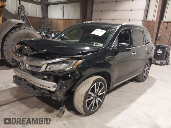 2020 Honda Pilot Touring 7-Passenger with VIN 5FNYF6H63LB032301, listed as a IAAI auction lot 38419333 with 50,433 mi miles and . Bid and sale history available at carsss.com. Image 2.