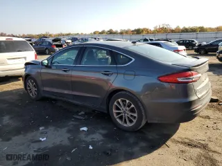 2020 Ford Fusion Plug-In Hybrid Titanium with VIN 3FA6P0SU5LR230939, listed as a Copart auction lot 77899134 with 104,656 mi miles and Salvage Title. Bid and sale history available at carsss.com. Image 2.