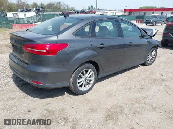 2017 Ford Focus SE with VIN 1FADP3F20HL335881, listed as a IAAI auction lot 42074241 with 127,741 mi miles. Bid and sale history available at carsss.com. Image 4.