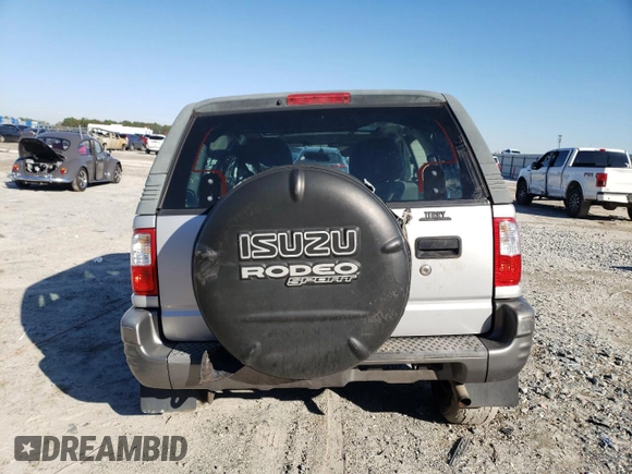 2002 Isuzu Rodeo z VIN 4S2CK57W524323426, wystawiony jako Copart lot #42191765 z przebiegiem 112 024 mil mil oraz Szkoda całkowita • Salvage title. Historia ofert i sprzedaży dostępna na DreamBid. Obrazek 6.
