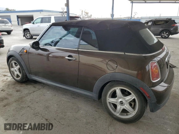 2010 MINI Convertible with VIN WMWMR3C50ATU97547, listed as a Copart auction lot 44780185 with 91,194 mi miles and Salvage Title. Bid and sale history available at DreamBid. Image 2.