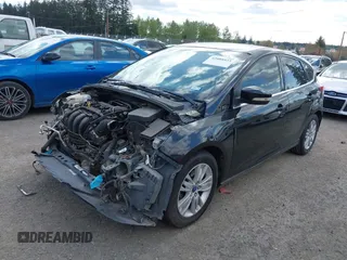 2012 Ford Focus SEL with VIN 1FAHP3M2XCL106248, listed as a IAAI auction lot 42088933 with 117,333 mi miles. Bid and sale history available at carsss.com. Image 2.