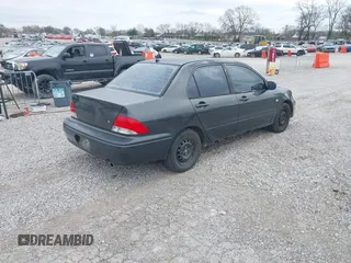 2003 Mitsubishi Lancer ES with VIN JA3AJ26E83U015342, listed as a IAAI auction lot 41819617 with 355,658 mi miles. Bid and sale history available at carsss.com. Image 4.