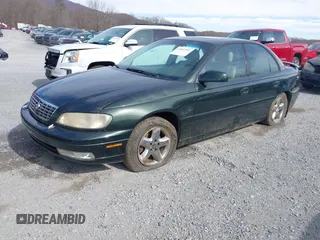 2000 Cadillac Catera z VIN W06VR54R0YR002664, wystawiony jako IAAI lot #41857553 z przebiegiem 86 354 mil mil oraz . Historia ofert i sprzedaży dostępna na DreamBid. Obrazek 2.