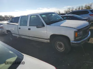 1999 GMC Sierra 1500 with VIN 1GTGC33RXXF096504, listed as a Copart auction lot 80027354 with 124,430 mi miles and Clean Title. Bid and sale history available at DreamBid. Image 4.