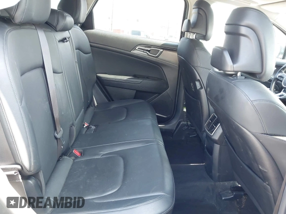 2023 Kia Sportage EX with VIN KNDPVCAG4P7014112, listed as a IAAI auction lot 42610022 with 50,680 mi miles and . Bid and sale history available at DreamBid. Image 8.