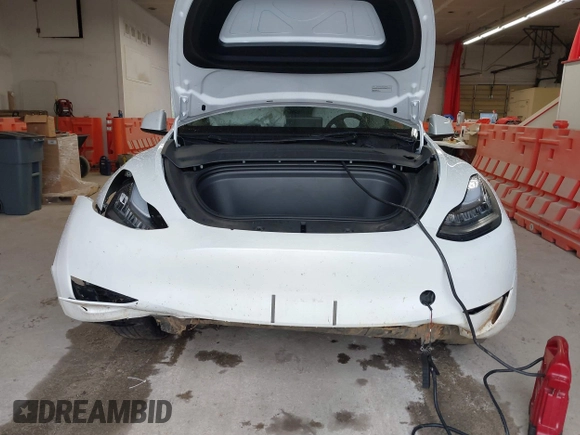 2023 Tesla Model Y Long Range with VIN 7SAYGDEE7PA100523, listed as a IAAI auction lot 40399455 with 18,885 mi miles and . Bid and sale history available at DreamBid. Image 12.